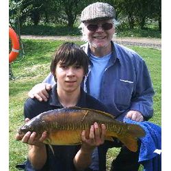 Robert Northman and his Grandfather enjoy a successful days fishing at Barford Lakes.